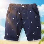 Short avec design dinosaure, idéal pour le jeu et l'été