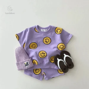 Vêtements enfants avec motifs souriants colorés